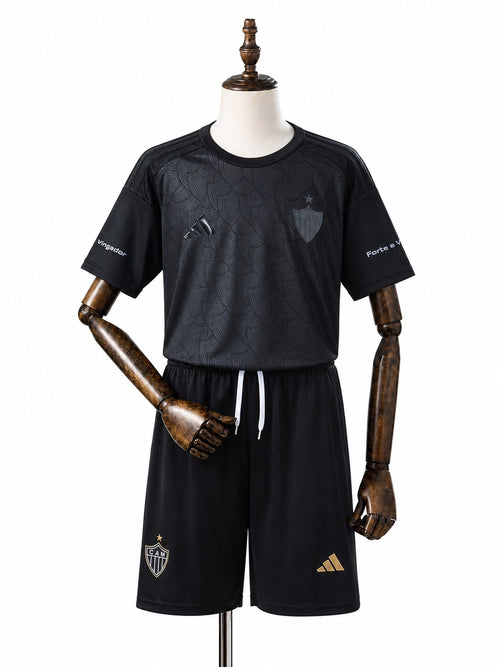 Atlético-MG 25/26 Limited Edition Black Kids Kit Jersey front wood mannequin white background