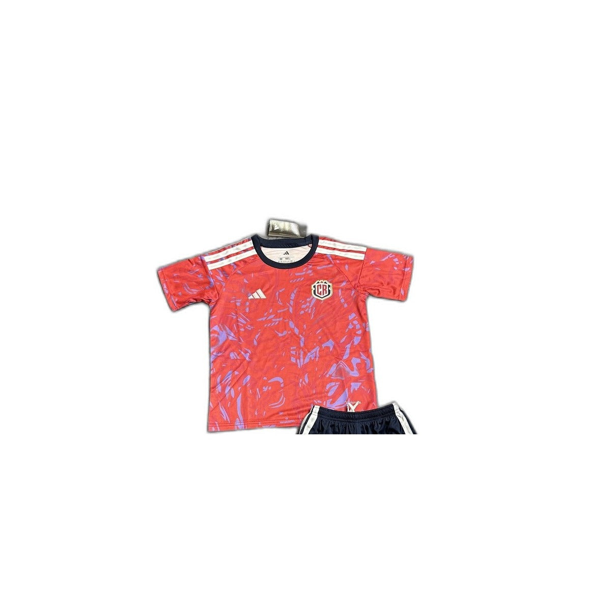 Camisa 2026 Costa Rica Home Infantil detalhe escudo manequim fundo branco