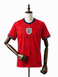 Camisa Inglaterra Visitante 2026 frente manequim madeira fundo branco