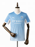 Camisa Manchester City - 1º Uniforme Jogador 2025/26 frente manequim fundo branco
