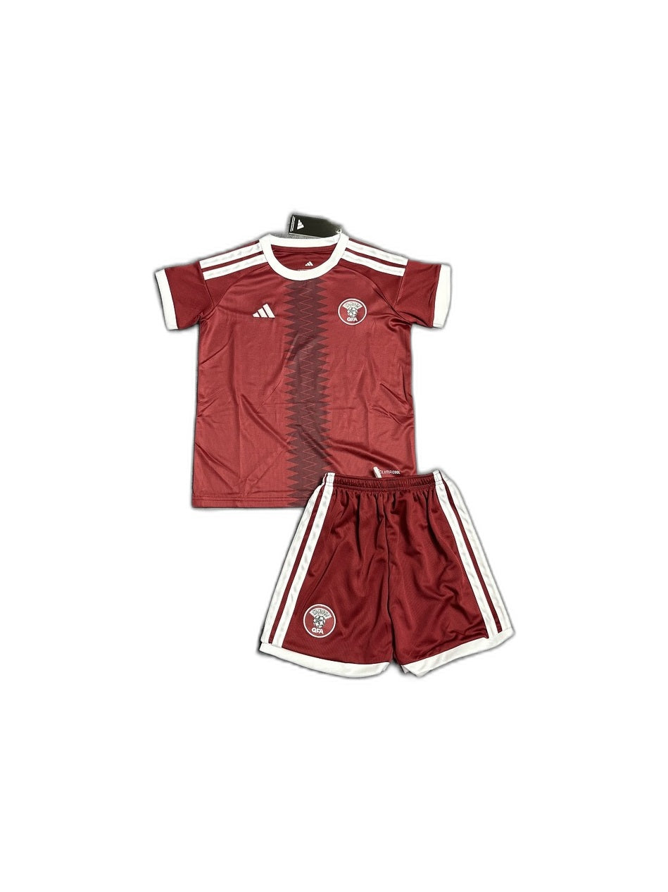 Camisa 2026 Qatar Home Infantil frente fundo branco