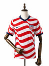 Camisa EUA Titular 2026 frente manequim madeira fundo branco
